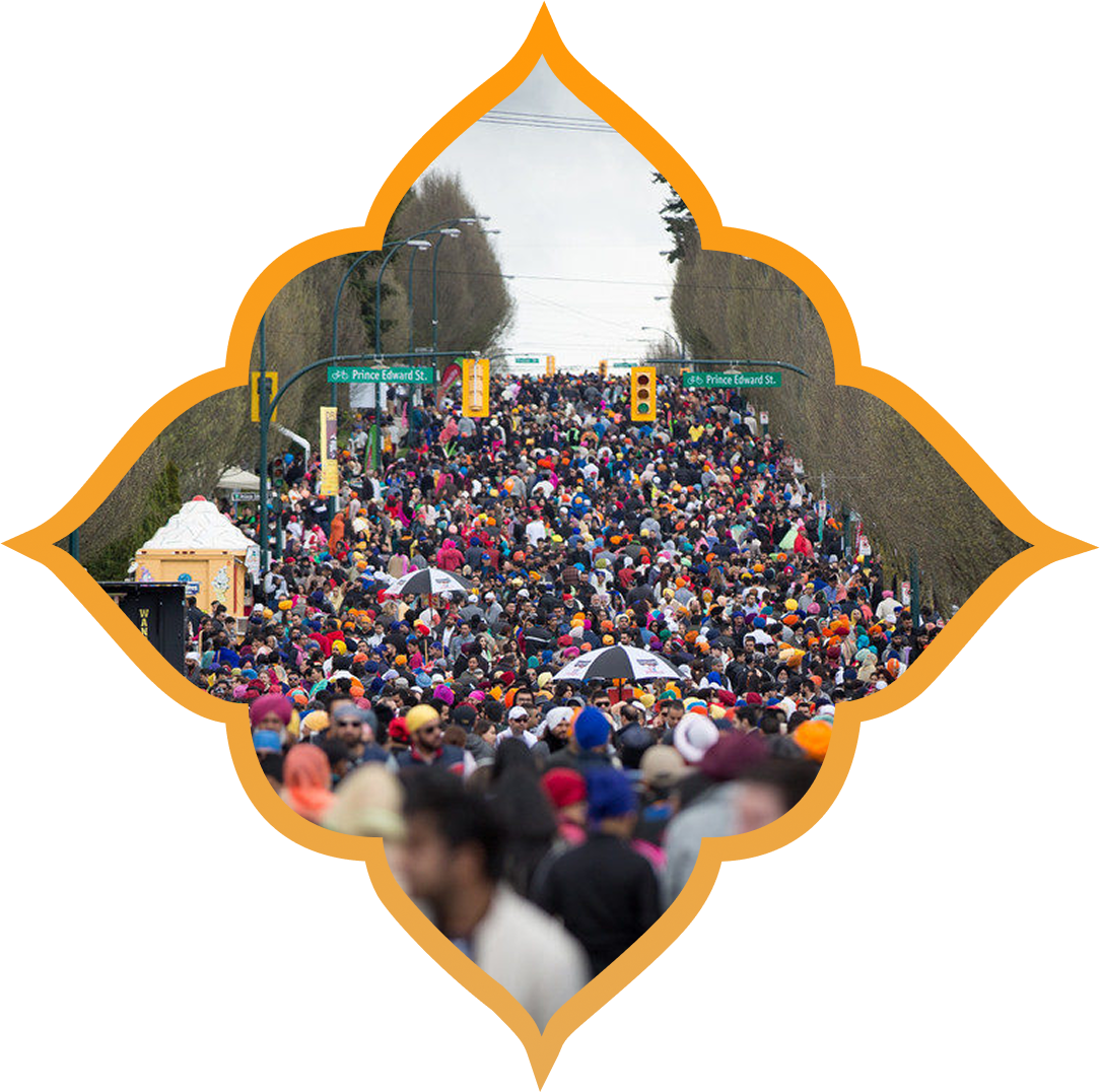 Large crowd at outdoor event with trees.